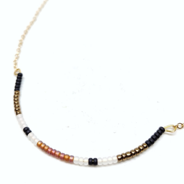 Detail of necklace centerpiece. Seed beads on delicate gold-plated chain.
