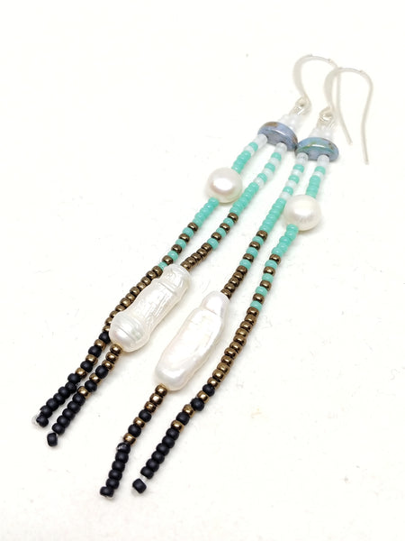 Calm Dangles: Silver-Plated ear wires, pearls, and white, blue, bronze and black seed beads.