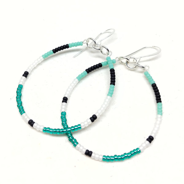 Energy Hoops: silver plated ear wires, seed beads in turquoise, black, white and emerald.