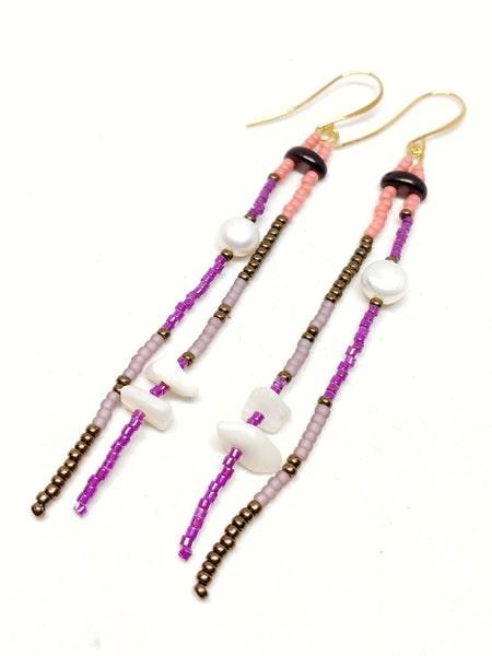 Joyful Dangles: Gold plated wire. Featuring pearls, mother of pear, and seed beads in bronze, salmon, amethyst and plum.