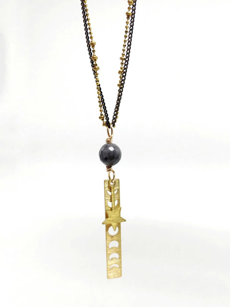 20" double chain necklace featuring delicate black brass chain and brass saturn ball chain. 60mm pendant with single larvikite bead and brass moon phase and falling star charms.