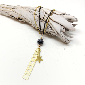 20" double chain necklace featuring delicate black brass chain and brass saturn ball chain. 60mm pendant with single larvikite bead and brass moon phase and falling star charms.