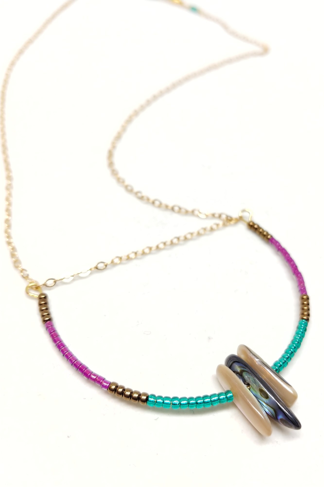 gold-plated necklace, delicate chain, U-shaped pendant with colorful seed beads and abalone.