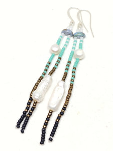 Calm Dangles: Silver-Plated ear wires, pearls, and white, blue, bronze and black seed beads.