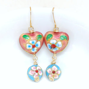 Gold dangly cloisonné bauble earrings featuring vibrant pinks and blues with daisy motifs.