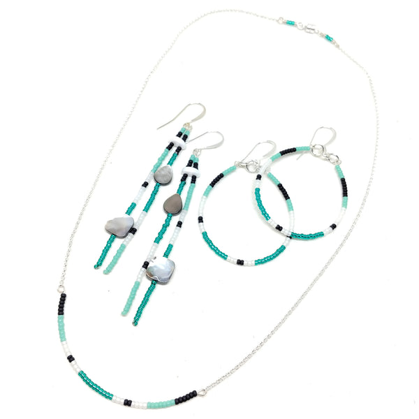 Energy jewelry set: sterling silver necklace, hoops and dangles, features seed beads in black, turquoise, white and emerald.