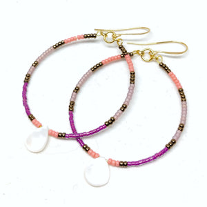 Joyful Hoops: Gold plated wire featuring seed beads in bronze, salmon, amethyst and plum, and a mother of pearl teardrop.