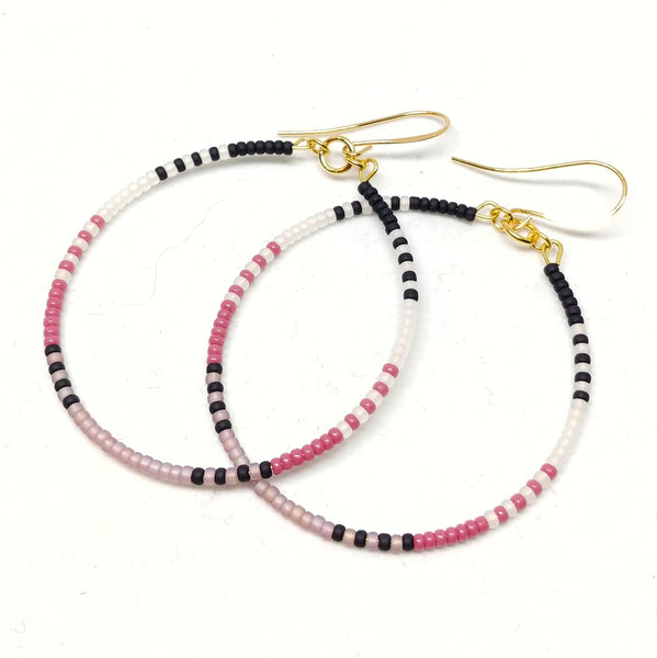 Gold plated wires. 2" hoops featuring seed beads in black, white, mulberry and amethyst.