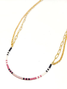 New Beginning Necklace: Gold plated chains in two style doubled up--rolo chain and paper clip chain--with U-shaped focal piece with seed beads in black, white, mulberry and amethyst.