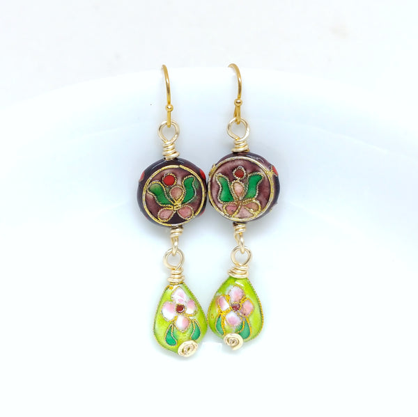 Gold dangly cloisonné bauble earrings featuring vibrant burgundy and green with orchid and daisy motifs.