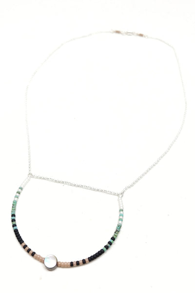 Peaceful Necklace: Sterling silver featuring a U-shaped focal piece with Abalone and seed beads in white, turquoise, black and beige.