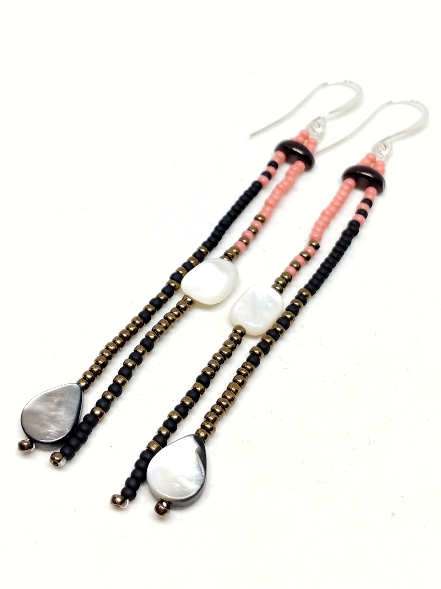Ready To Rise Dangles: Silver wires featuring white and black lip mother of pearl, and seed beads in salmon, black and bronze.