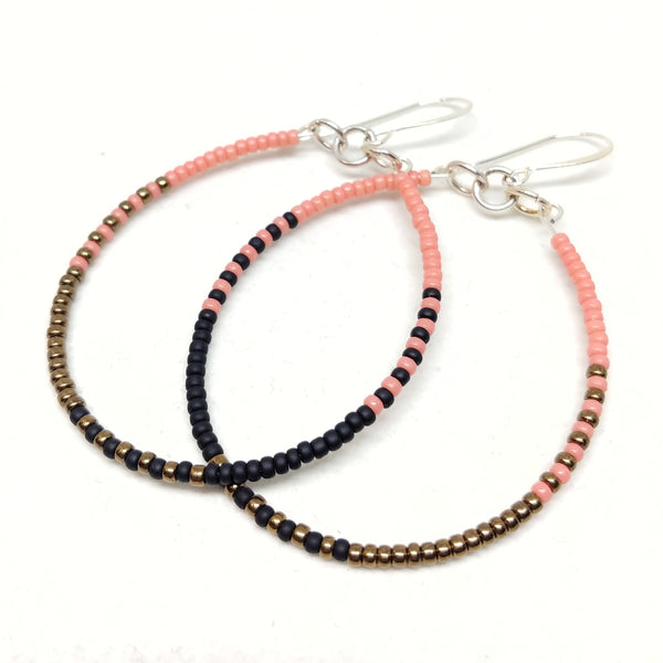 Ready To Rise Hoops: Silver wires featuring  seed beads in salmon, black and bronze.