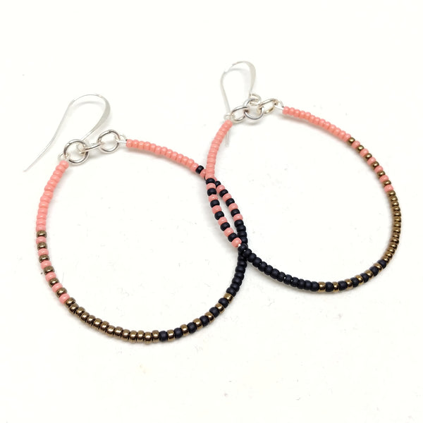 Ready To Rise Hoops: Silver wires featuring seed beads in salmon, black and bronze.