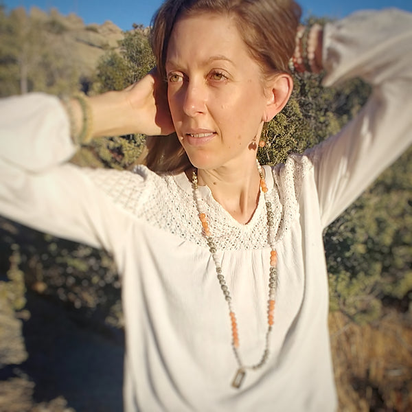 Model wearing Desert Wildflower Earrings, dangle earring, tangerine jade, dalmatian jasper, brass chain and ear wires