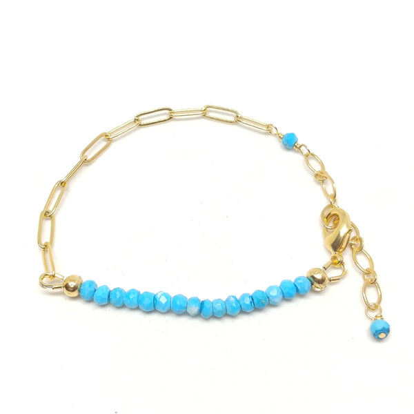December birthstone turquoise bracelet on gold-plated paper clip chain.