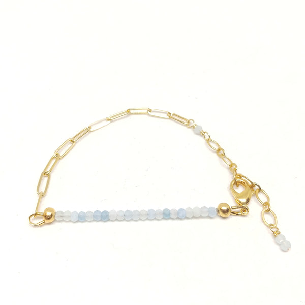March birthstone aquamarine bracelet on gold-plated paper clip chain.