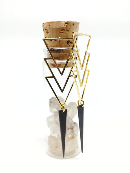 82mm long gold-plated triple layered triangle studs with black dagger shown hanging.