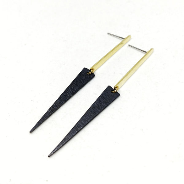 65mm long Brass bar studs with attached elongated black triangle charm.