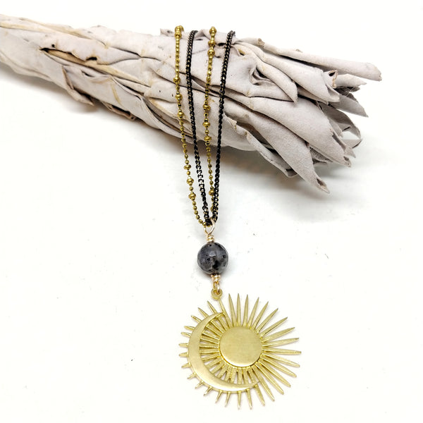 20" chain with 50mm pendant.   Double chains: black oxidized brass and brass saturn ball chain with black brass clasp.   Pendant: Larvikite bead with brass sun and moon pendant.