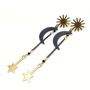 70mm. Brass sunburst studs with dangling black brass crescent moons and brass falling star charms hanging from black chain with black crystals.