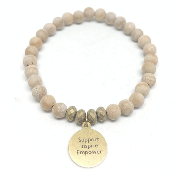Mother's day stretch silk wood bracelet featuring brass "Support, Inspire, Empower" charm.  