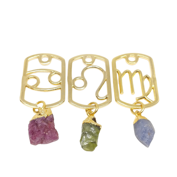 Gold Zodiac Dog Tags with raw birthstones: Cancer & Ruby, Leo and Peridot, Virgo & Sapphire.